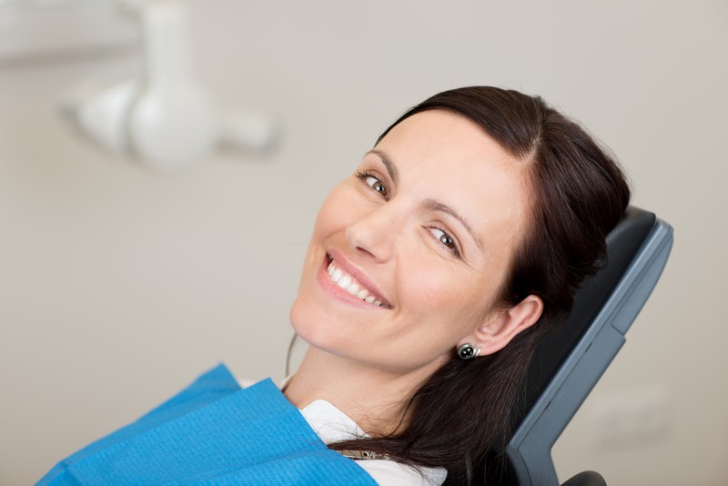 Relaxed patient smiling in the dental chair