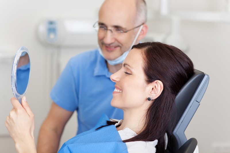 Periodontist explaining a treatment plan to a patient